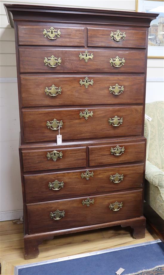 A George III mahogany chest on chest circa 1765, with original brass furniture on shaped bracket feet H.177.5cm, W.100cm